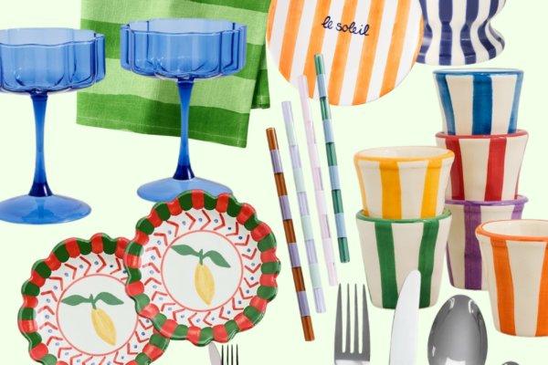 Colorful kitchenware collage featuring striped linen napkins, hand-painted bowls and cups, blue stemware, patterned plates with lemons, pastel striped straws, monogrammed cocktail napkins, blue-handled flatware, and bold ceramic serving pieces in vibrant pink, green, orange, blue, red, and purple tones.